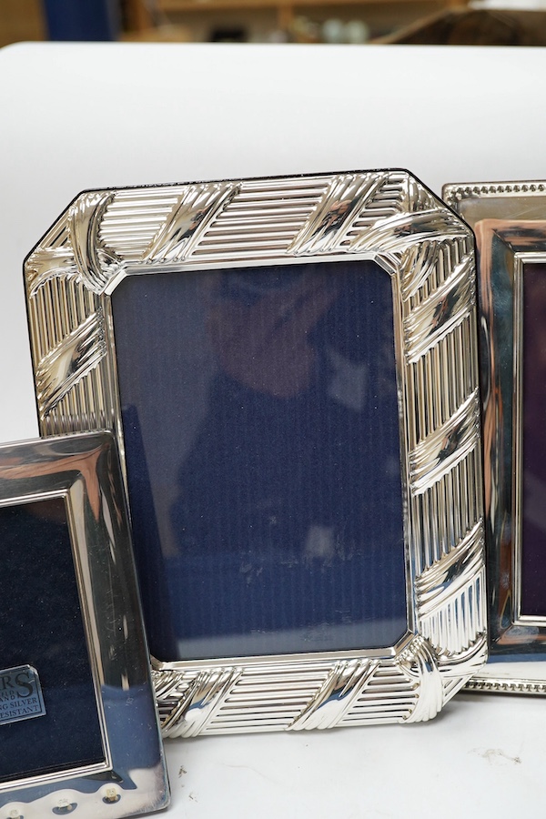 A modern boxed Carr's of Sheffield, silver mounted double photograph frame, width 18.3cm, together with two other silver mounted photograph frames and an Italian silver plated frame. Condition - good